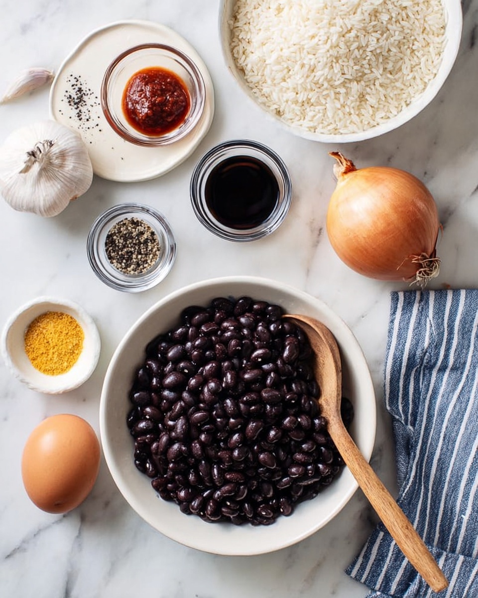 A white bowl filled with shiny black beans sits in the center, with a wooden spoon resting inside. Around it, arranged on a white marbled surface, are a white plate with a swirl of black pepper, two small glass bowls with dark liquids, one small glass bowl containing red sauce, a small white dish with yellow powder, a whole onion, a garlic bulb, a brown egg, and a white bowl filled with uncooked rice partially covered by a blue and white striped cloth. photo taken with an iphone --ar 4:5 --v 7