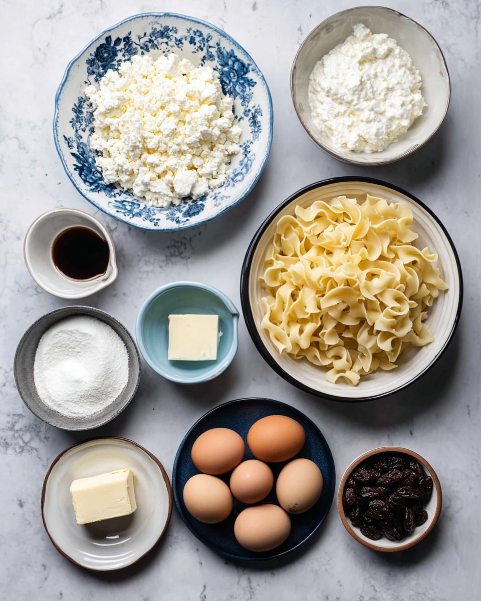 The image shows eight bowls and plates arranged on a white marbled surface, each holding a different ingredient. In the top left, a white bowl with a blue floral pattern is filled with white cottage cheese that has a crumbly texture. To its right, a plain white bowl contains smooth, white ricotta cheese. Below the blue floral bowl, a small light blue bowl holds a small amount of dark brown liquid, possibly vanilla extract. At the center right, a large white bowl with a black rim is full of uncooked pale yellow egg noodles with a curled shape. Below that, a dark blue plate contains a mix of brown and white eggs arranged in a circle. To the bottom left, a black bowl is filled with white granulated sugar. Next to it, a white plate with a brown rim holds a square of pale yellow butter. To the right, a black bowl contains white cream cheese, and lastly, a small white bowl at the bottom right holds dark brown raisins. photo taken with an iphone --ar 4:5 --v 7