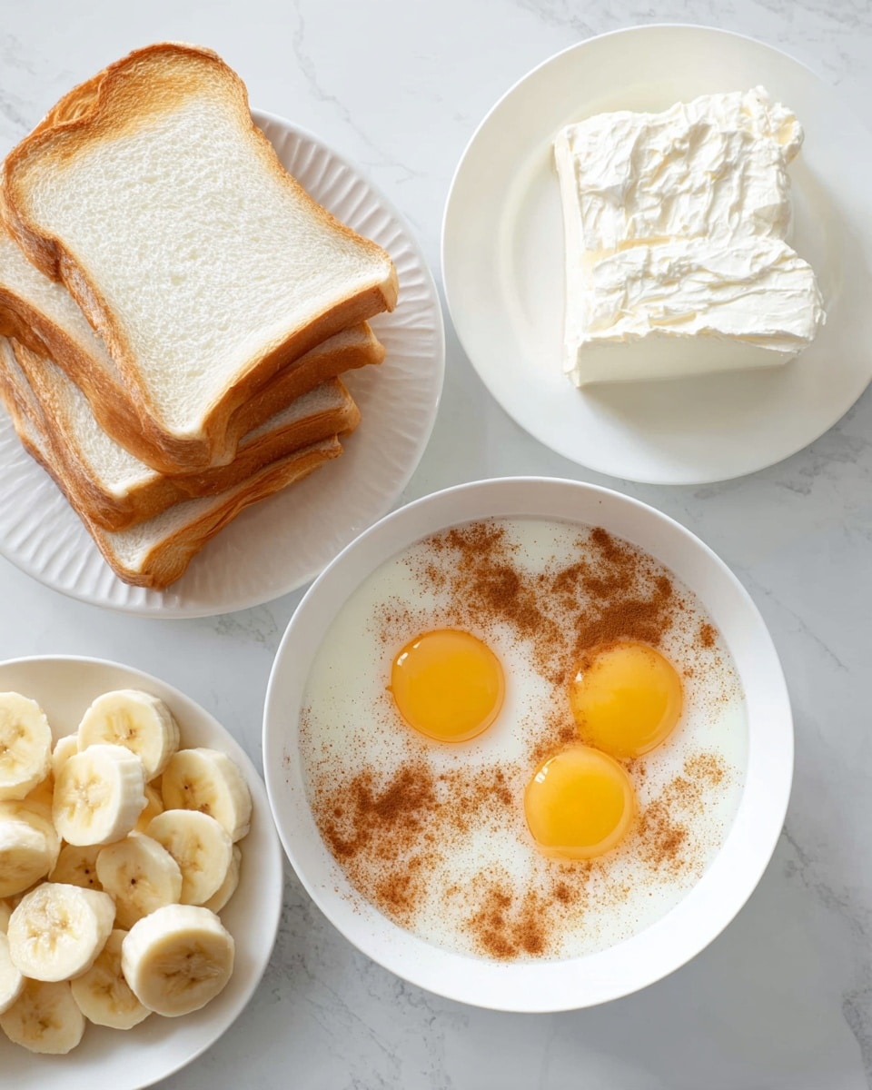 The image shows four main parts arranged on a white marbled surface. In the bottom center, there is a white bowl with four raw eggs with bright yellow yolks floating in light milk mixed with brown cinnamon powder sprinkled over the top. To the left, there is a stack of thick white bread slices leaning slightly, showing their soft texture and light golden crust. Above the bowl of eggs, a white plate holds a block of white cream cheese with a smooth surface. To the right, another white plate contains peeled bananas cut into sections of different lengths, showing the soft yellow interior. Photo taken with an iphone --ar 4:5 --v 7