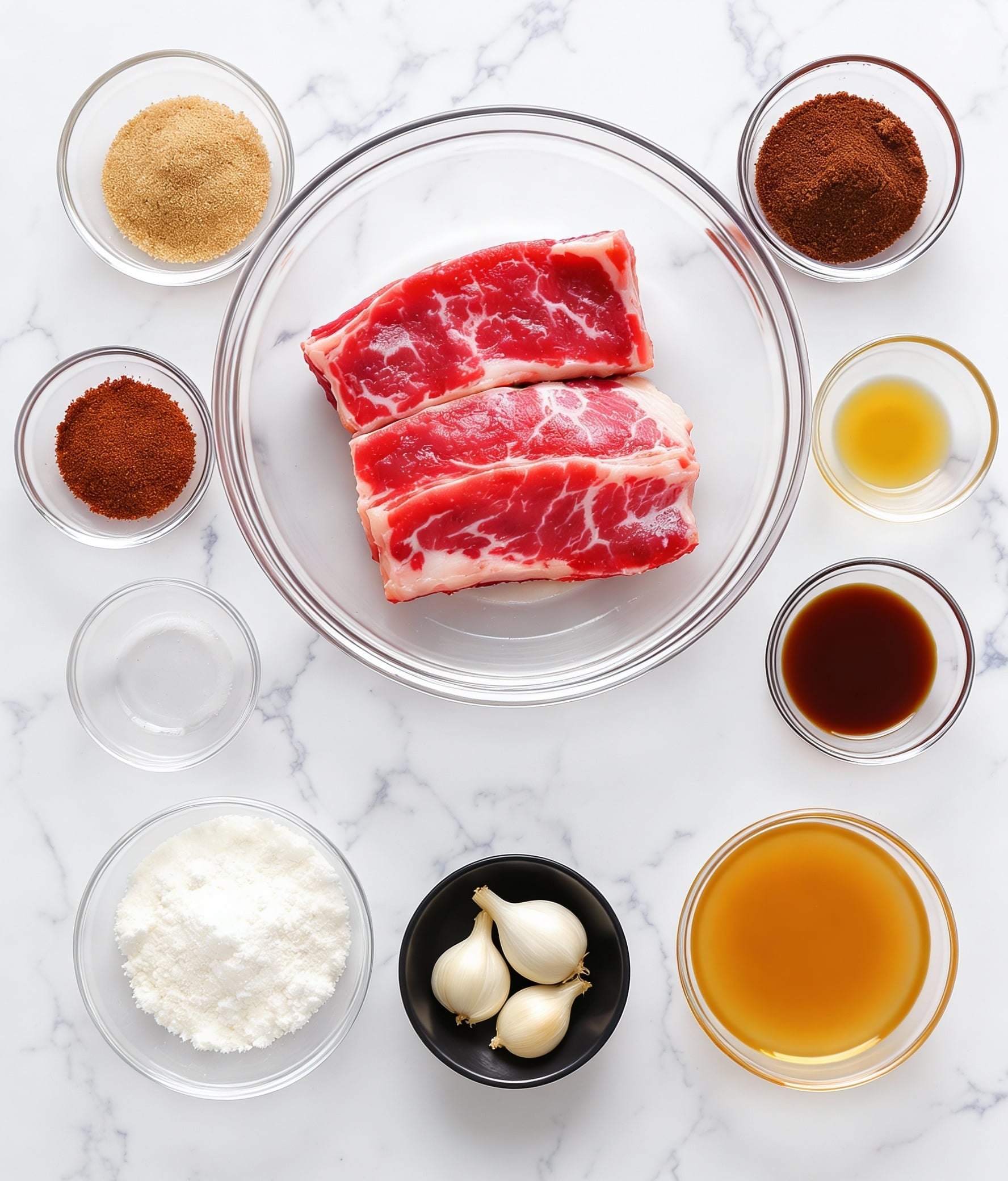 The image shows several clear glass bowls and small dishes arranged on a white marbled surface, each containing different ingredients. At the top center, a clear glass bowl holds three raw short ribs, bright red with white fat. Surrounding this main bowl are smaller bowls and dishes: light brown soft brown sugar, dark red coarse gochugaru, dark amber sesame oil, dark brown soy sauce, dark brown beef broth, white cornstarch, a piece of light beige ginger, three white garlic cloves in a small black bowl, and a small bowl of light beige mirin. Each ingredient is neatly separated and labeled. photo taken with an iphone --ar 4:5 --v 7