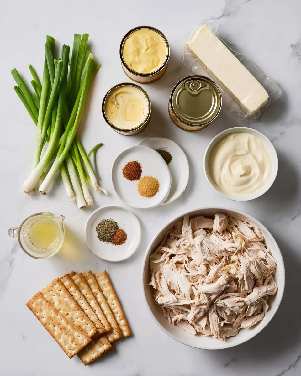 The image shows all the ingredients for a dish arranged neatly on a white marbled surface. On the right, there is a white bowl filled with shredded cooked chicken. Next to it are two white plates with small round portions of mustard, black pepper, and light brown spices. Above them are two open cans of a creamy yellow substance, and a stick of butter wrapped in paper lies nearby. On the left, a bunch of fresh green onions rests beside a small white bowl full of sour cream and a clear measuring cup with yellow liquid. Two packs of light brown crackers are placed just above the shredded chicken bowl. Photo taken with an iphone --ar 4:5 --v 7