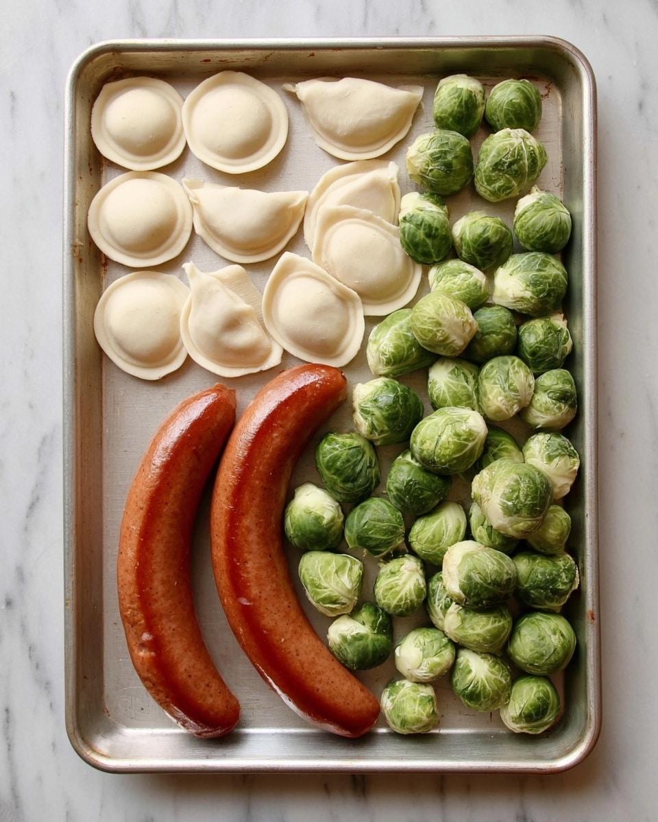 A metal baking tray holds three groups of food items on a white marbled surface: the top left section has a pile of white, round ravioli with smooth edges, the top right section features a large, curved sausage with a shiny, reddish-brown skin, and the entire bottom half is filled with many green Brussels sprouts that have a textured surface and some showing small stalks. The items are evenly spaced and the tray is viewed from above. photo taken with an iphone --ar 4:5 --v 7