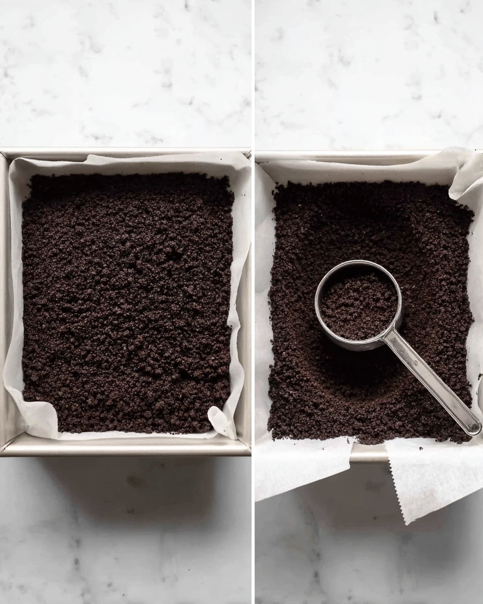 The image shows two views of a square baking pan lined with white parchment paper on a white marbled surface. The pan is filled with a single layer of finely crushed dark brown cookie crumbs that look soft and crumbly. On the right, a small silver measuring cup is pressed into the cookie crumbs, making a shallow round indentation in the even layer. The cookie crumbs cover the whole base of the pan in both views, creating a flat, dense layer. photo taken with an iphone --ar 4:5 --v 7