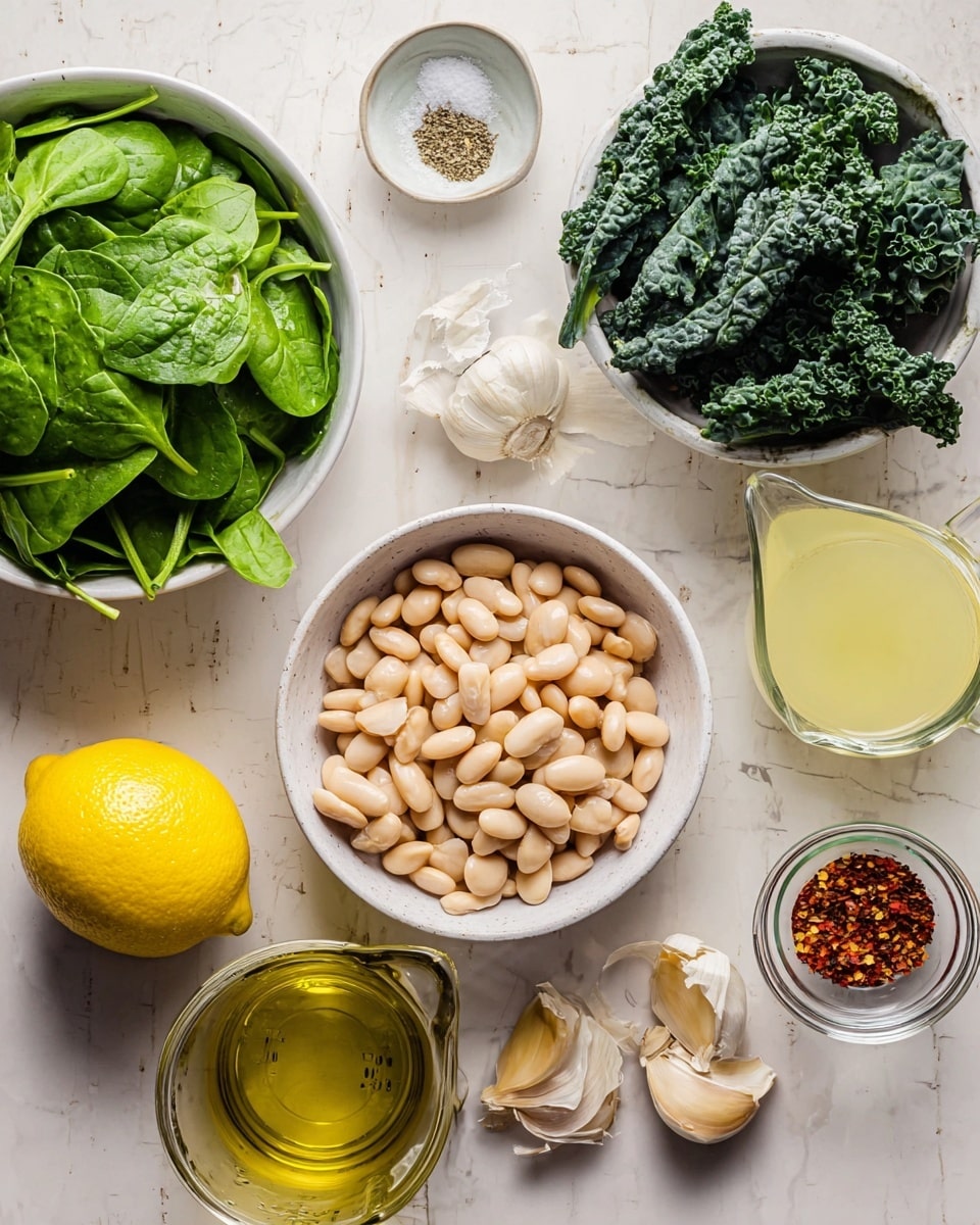 The image shows a top-down view of various ingredients arranged neatly on a white marbled texture. In the center is a white bowl filled with light beige beans, smooth and plump. Surrounding it are several other containers and items: a large white bowl on the left holding fresh, bright green spinach leaves, and on the right, a white bowl with dark green, curly kale leaves. Above the beans is a small white dish with salt and pepper, and to its right is a glass measuring cup filled with pale yellow broth. Below the beans are a whole lemon, a shallot, three peeled garlic cloves, and a small clear bowl with golden olive oil. A small glass bowl containing red pepper flakes is also visible. The colors are natural and earthy, giving a fresh and healthy vibe. Photo taken with an iphone --ar 4:5 --v 7