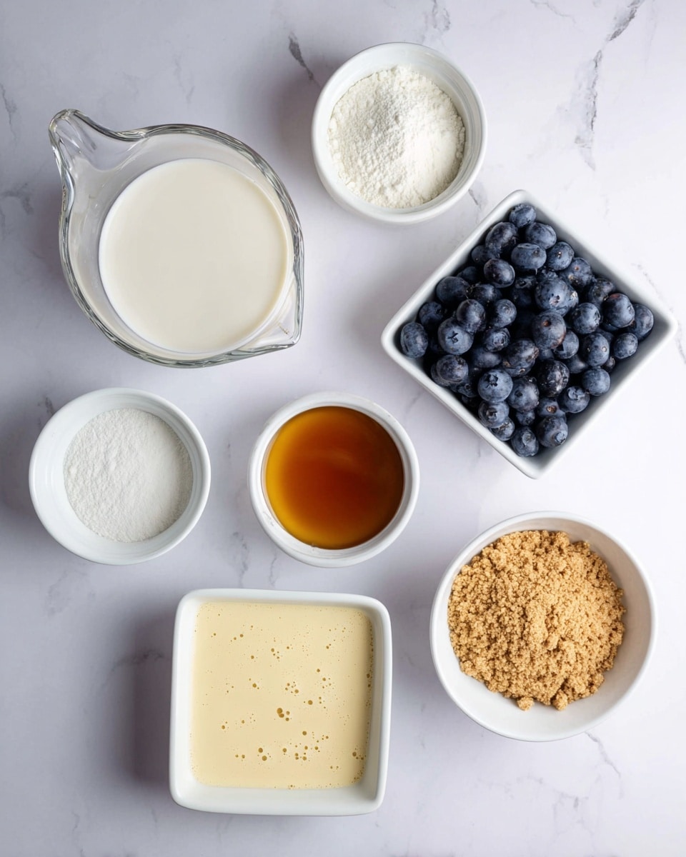 A top-down view shows six small white bowls and a glass measuring cup arranged on a white marbled surface. The glass measuring cup at the top left is filled with a creamy white liquid. Below it, a small white bowl contains a white powder, and next to it is another white bowl filled with a dark amber liquid. In the center, a white bowl holds a smooth pale yellow liquid with small bubbles on the surface. To the right, a square white bowl is full of fresh dark blue blueberries, and below it, a round white bowl contains light brown crushed crumbs with a coarse texture. Photo taken with an iphone --ar 4:5 --v 7