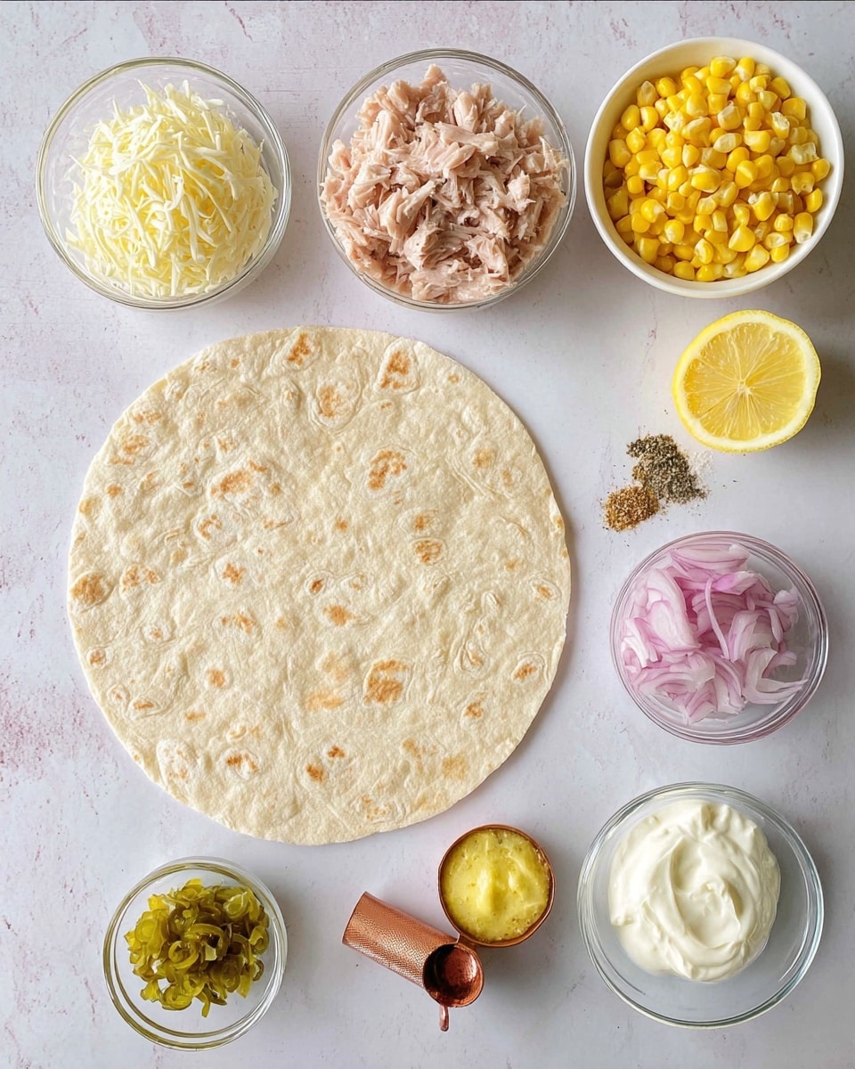 A round, light beige tortilla with a soft, slightly bubbly texture lies flat on a white marbled surface at the center. Surrounding it are several small clear glass bowls and a white bowl: at the top left, shredded white cheese; next to it, bright yellow corn kernels; a half lemon cut to show light yellow flesh; a bowl filled with flaky light pink tuna chunks; a copper measuring spoon containing small red onion cubes; a small glass bowl with green pickle bits; another glass bowl holding white sour cream topped with yellow mustard; and a small white bowl containing beige and black spices. The items are neatly arranged above and to the right of the tortilla, all on the white marbled background. Photo taken with an iphone --ar 4:5 --v 7