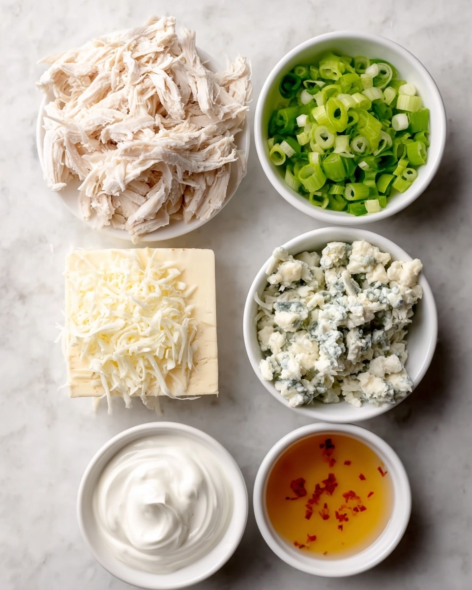 The image shows six separate ingredients on a white marbled surface arranged closely together. At the top left is a white plate piled high with shredded white chicken. To the right, a small white bowl is filled with bright green sliced scallions. Below the chicken, there is a loose mound of finely shredded white cheese. At the bottom left is a solid block of white cheese with a smooth surface. Next to the shredded cheese, on the right, there are three small white bowls stacked vertically: the top bowl holds white sour cream with a smooth, swirled texture, below it is a bowl of crumbled blue cheese showing greenish-blue veins, and at the bottom is a bowl containing a light amber-colored liquid with red specks. photo taken with an iphone --ar 4:5 --v 7