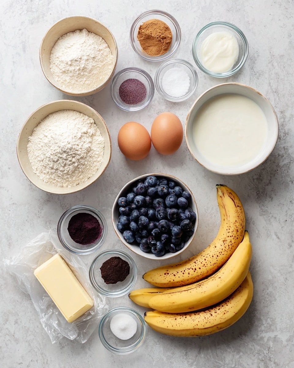 A flat lay of baking ingredients arranged neatly on a white marbled surface, including three ripe yellow bananas with brown spots on the right side. There are two brown eggs placed in a small white bowl in the center. A bowl of fresh dark blue blueberries sits below the eggs. To the left of the eggs and blueberries are two different bowls of white powders, one is flour in a beige bowl and a smaller bowl of baking powder. Above the eggs, a medium white bowl holds thick white yogurt. Surrounding these are several small clear glass bowls with dark brown sugar, a purple powder, cinnamon, coconut oil, vanilla extract, and white granulated sugar, plus a stick of opened salted butter wrapped in paper at the bottom. photo taken with an iphone --ar 4:5 --v 7
