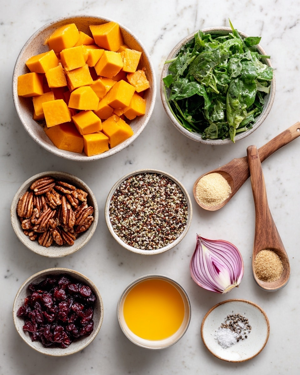 A top view of several small white bowls on a white marbled surface, each filled with different ingredients: bright orange cubes of butternut squash in a larger bowl at the top center, multicolored quinoa grains in a bowl to the right, deep green baby greens in a bowl slightly below center, dark brown pecans in a small bowl at the left, and dark red dried cranberries in another small bowl below the pecans. A halved shallot with pinkish purple layers is placed near the right side. Two small wooden spoons each hold a powder, one pale beige labeled garlic powder and the other brown labeled cinnamon. A bowl below the garlic powder spoon holds bright orange liquid labeled orange juice. A small white plate with a mix of salt and black pepper is at the bottom right. The arrangement is neat and well spaced. Photo taken with an iphone --ar 4:5 --v 7