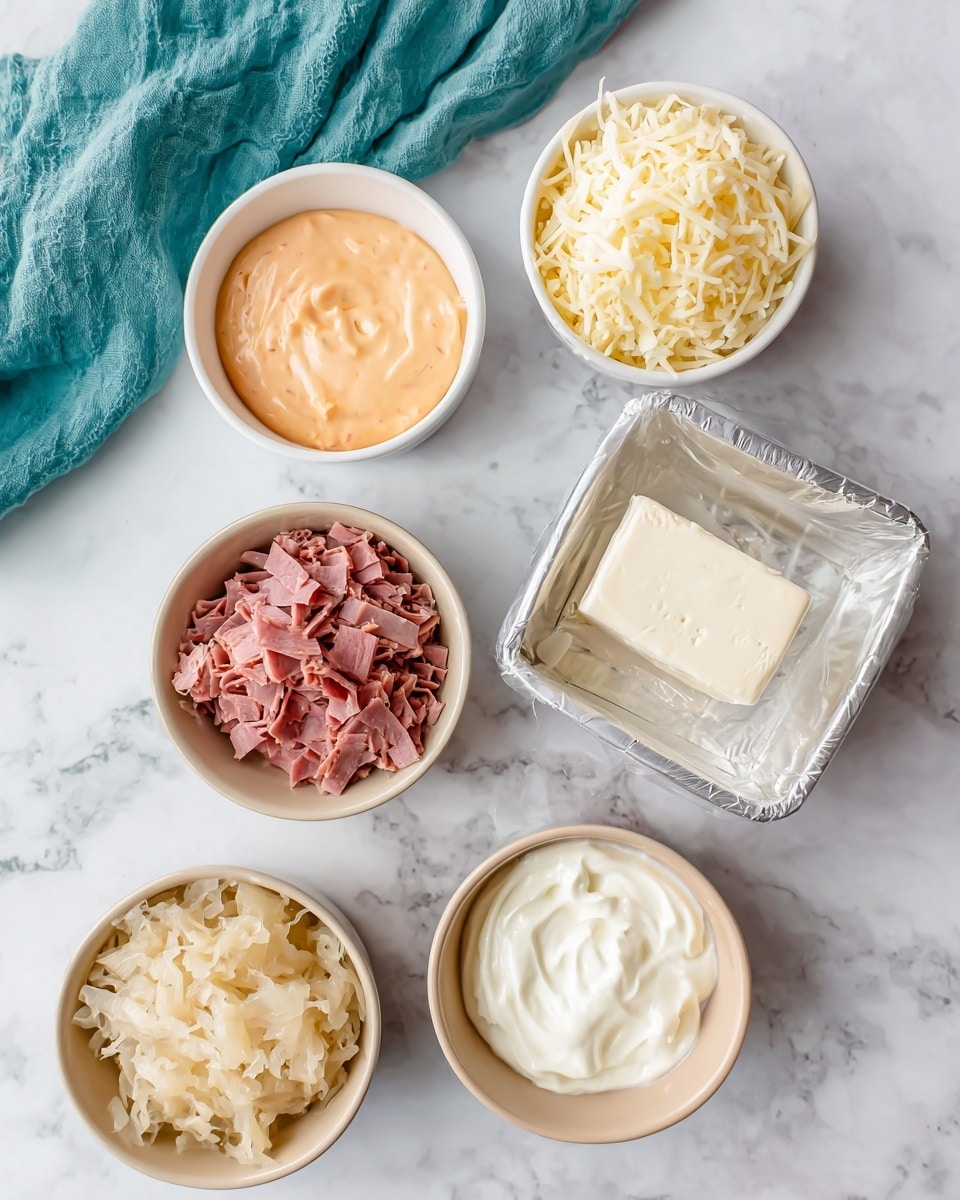 The image shows six small bowls and one wrapped block arranged on a white marbled surface. The top left bowl contains smooth, orange Thousand Island dressing. To its right is a light beige bowl filled with shredded Swiss cheese. Below the Swiss cheese is a white bowl full of pinkish deli corned beef shreds. To the bottom left is another beige bowl holding sauerkraut with a shredded, pale yellow color. Beneath the dressing is a square white bowl with a dollop of thick, white mayo. Below and slightly right of the corned beef is a beige bowl packed with thick, creamy white sour cream. Finally, to the bottom right, there is a wrapped silver block labeled cream cheese. A teal cloth is partially visible on the upper left corner. Photo taken with an iphone --ar 4:5 --v 7